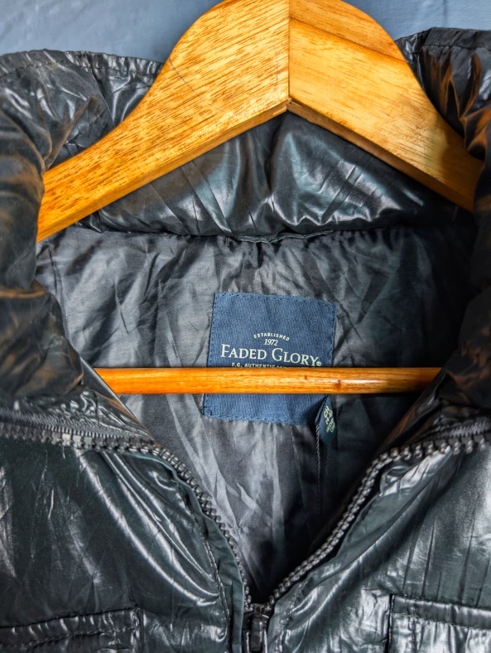 Women's shiny black hooded puffer vest