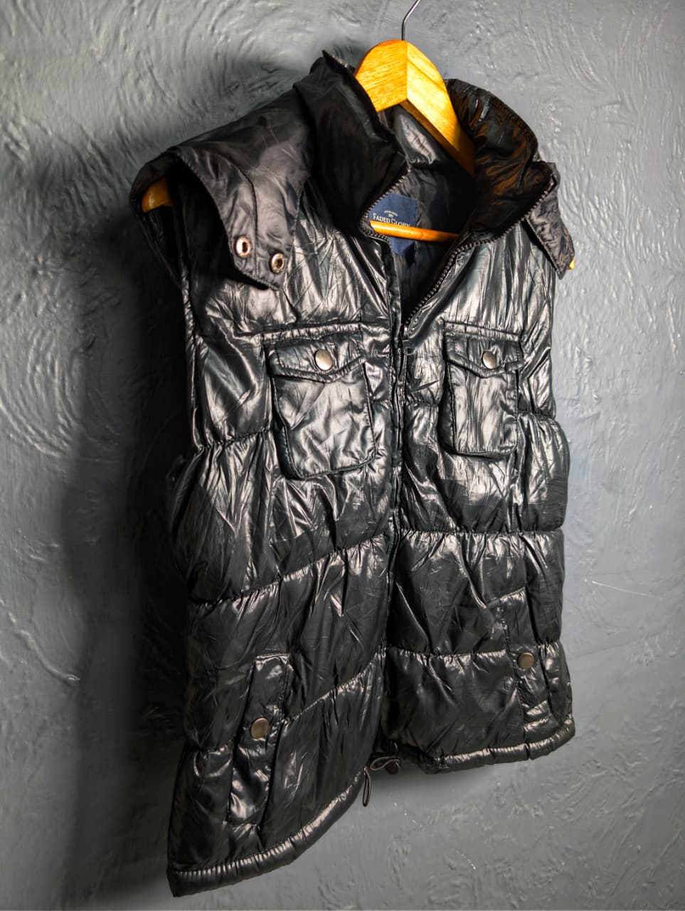 Women's shiny black hooded puffer vest