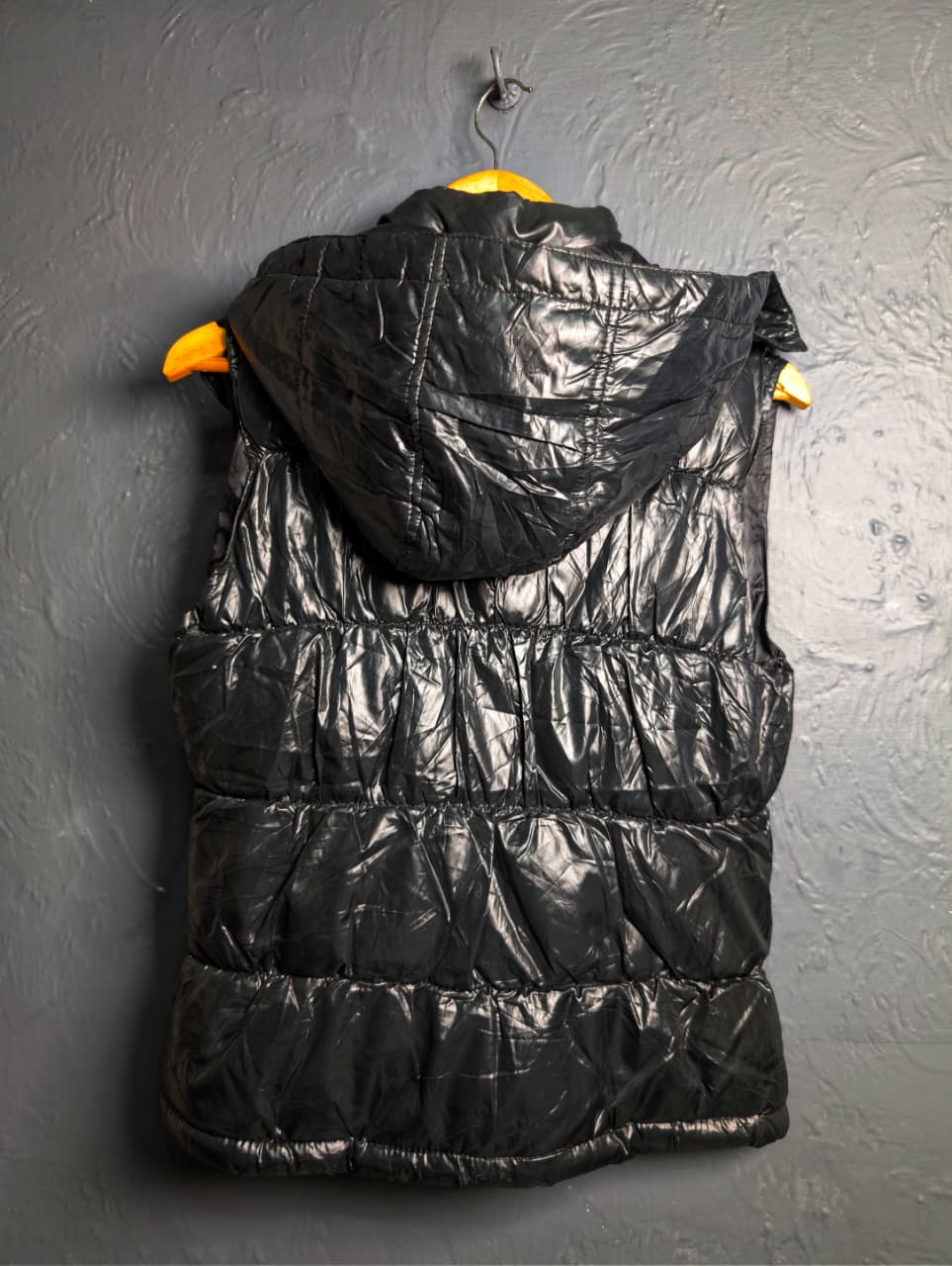 Women's shiny black hooded puffer vest