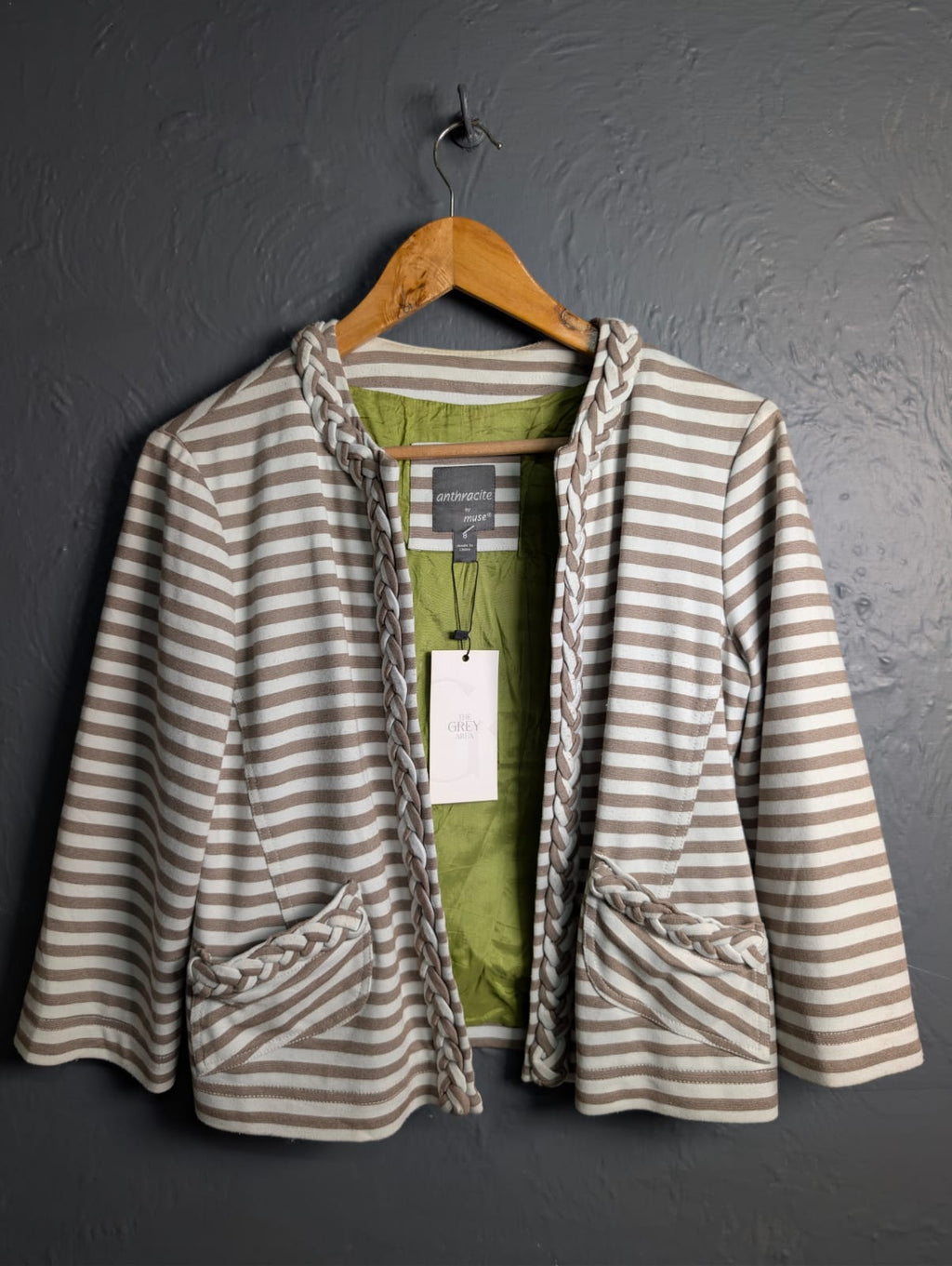 Women's open-front jacket with braided trim along the collar