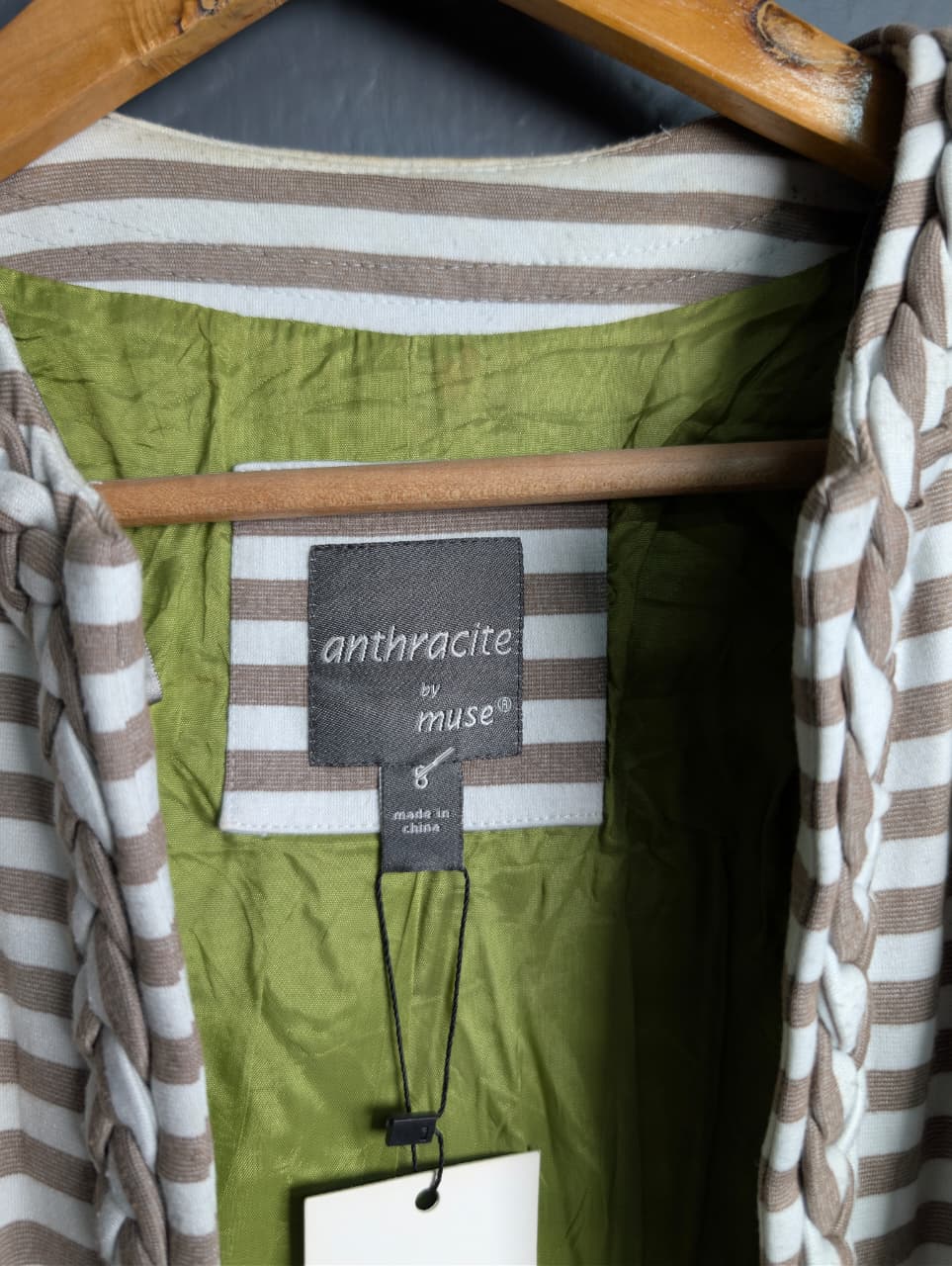 Women's open-front jacket with braided trim along the collar