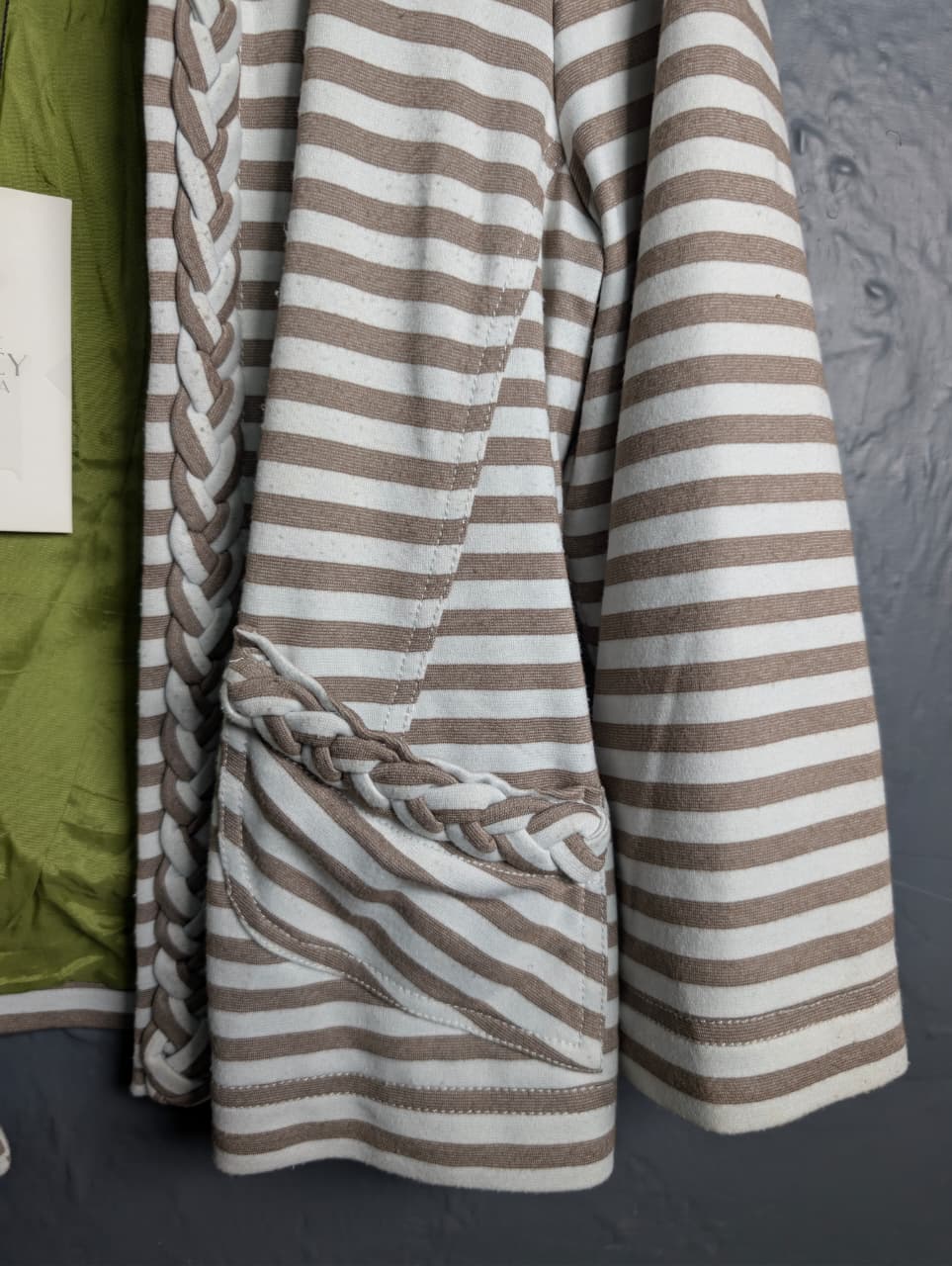 Women's open-front jacket with braided trim along the collar