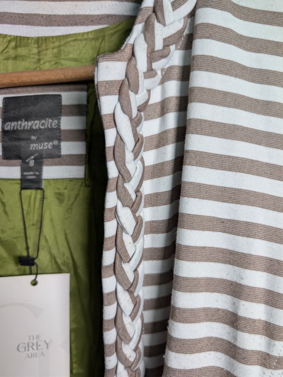 Women's open-front jacket with braided trim along the collar