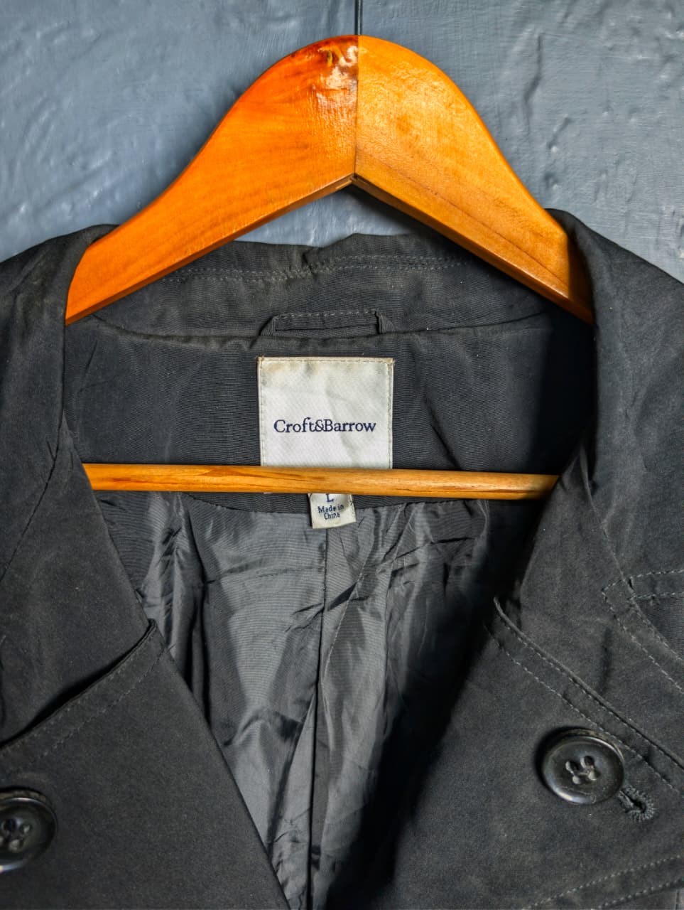 Women's jet black trench coat with a single-breasted design with a 3-button front closure