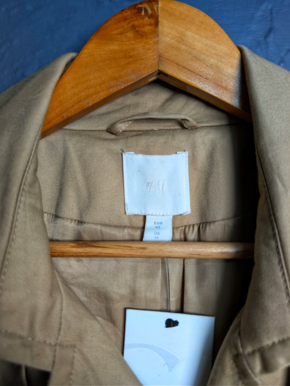 Beige Double-breasted Mama trench coat from H&M.