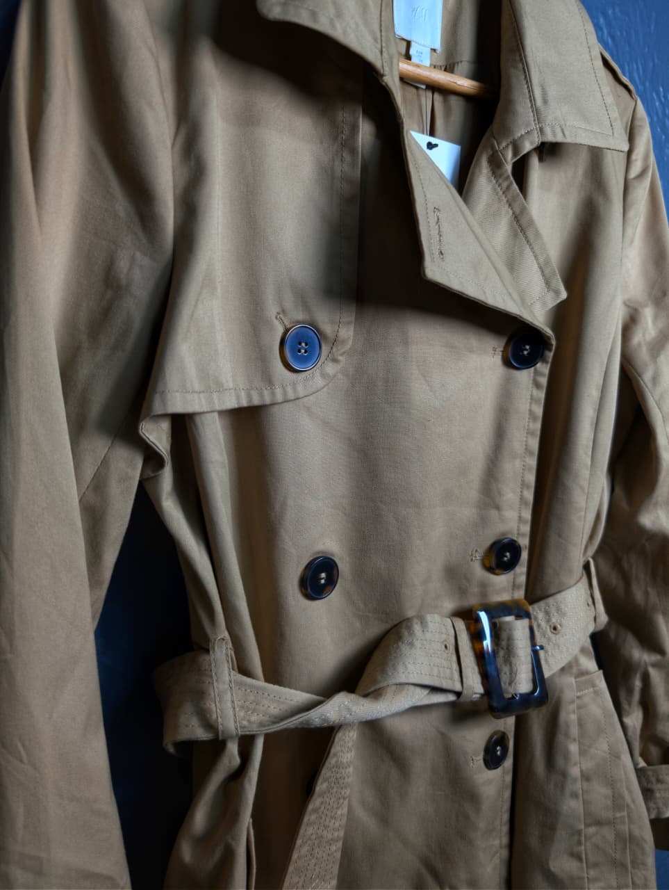 Beige Double-breasted Mama trench coat from H&M.