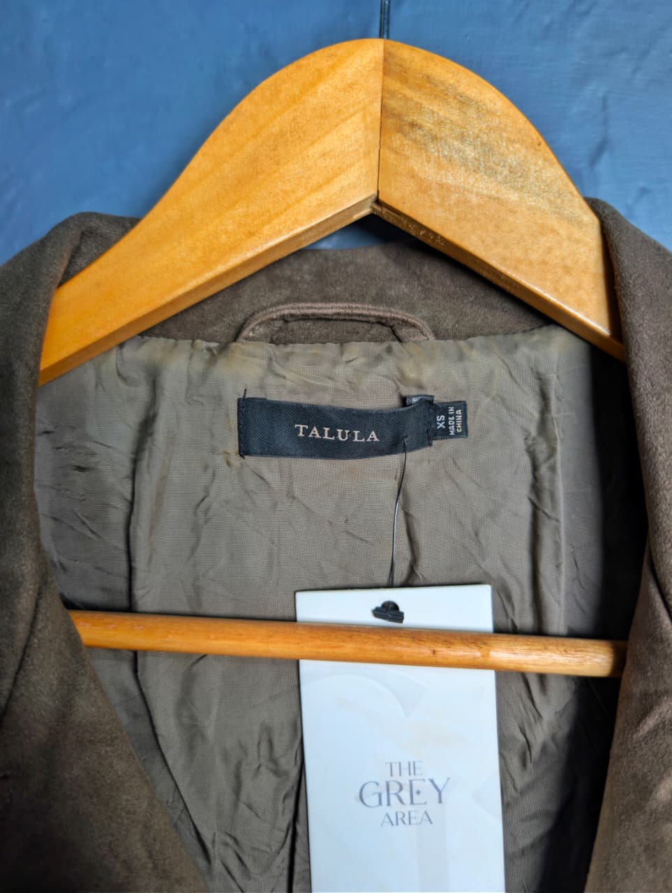 Women's cropped moto-style (biker) jacket featuring an asymmetrical zip front and notched lapels.