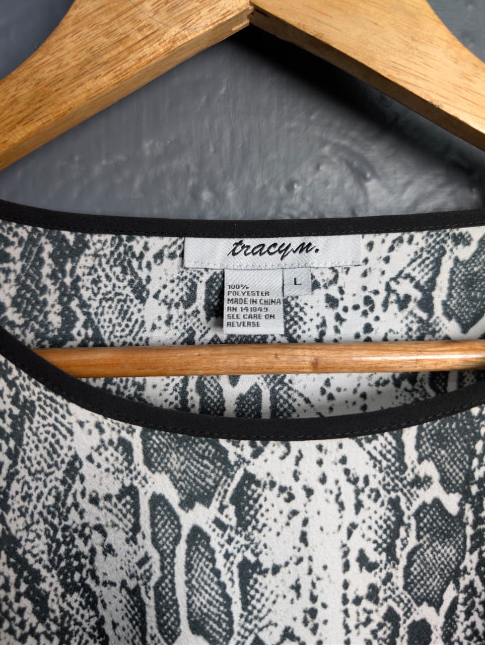 Women's Grey and black top with python print.