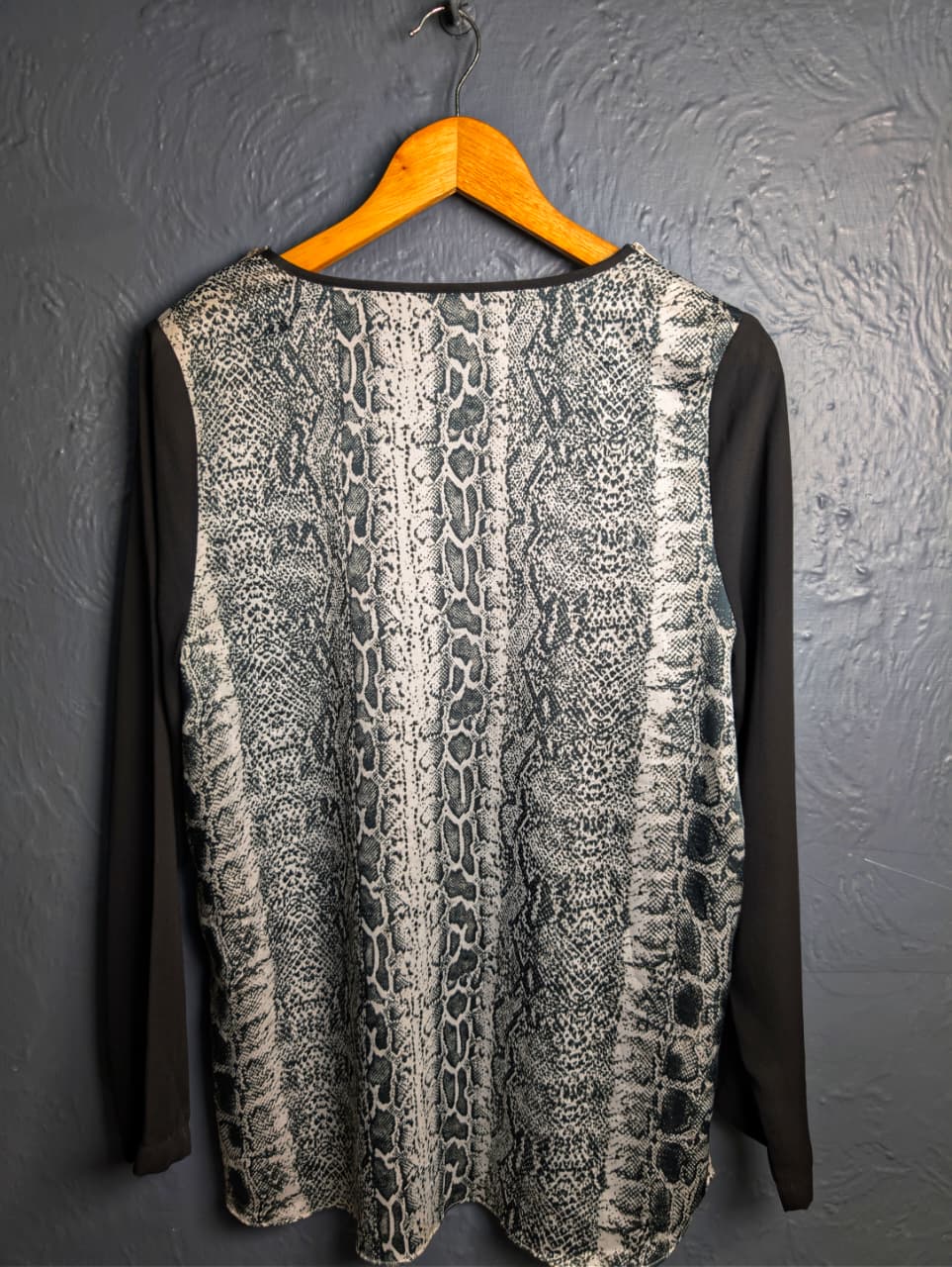 Women's Grey and black top with python print.