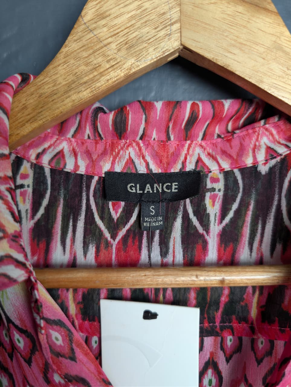 Glance button-down shirt with a pink and green ikat geometric pattern