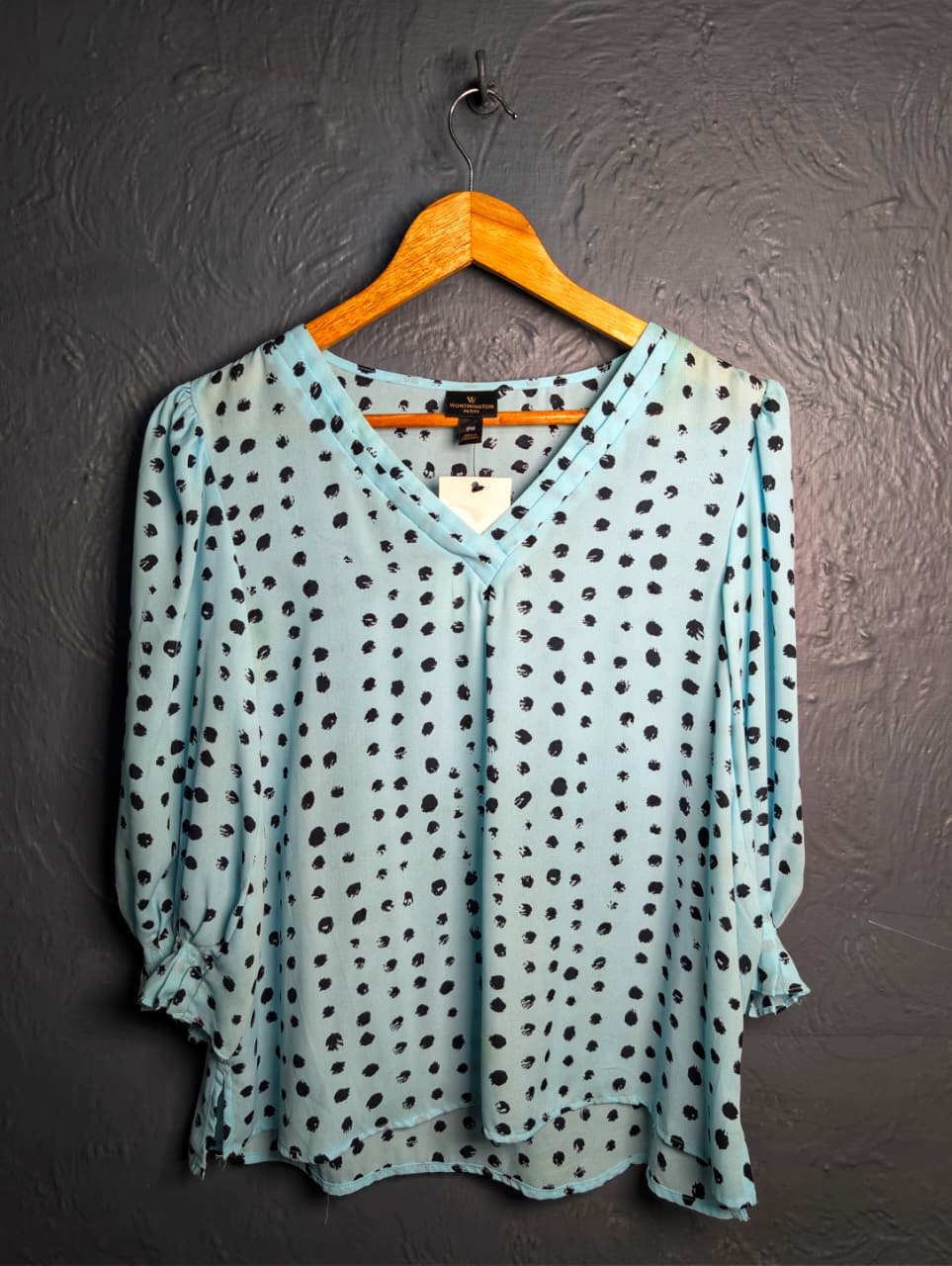 Worthington light blue top with a black polka dot pattern.