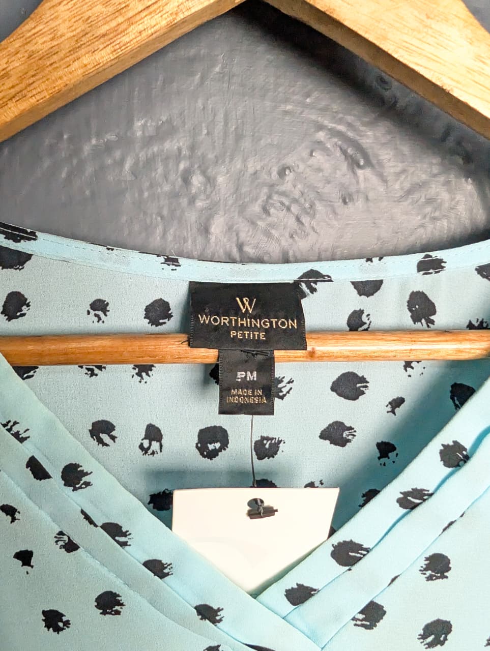 Worthington light blue top with a black polka dot pattern.