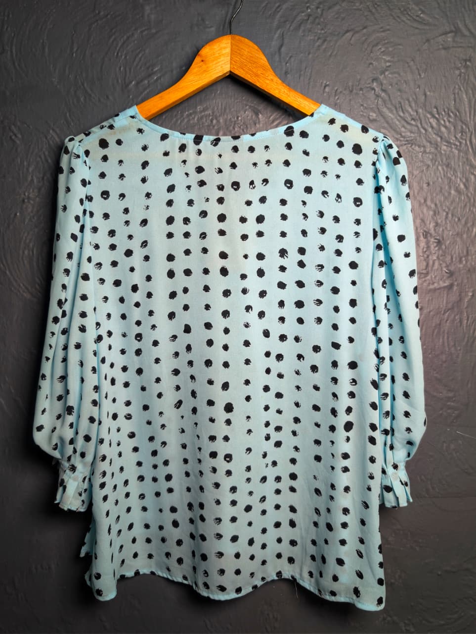 Worthington light blue top with a black polka dot pattern.