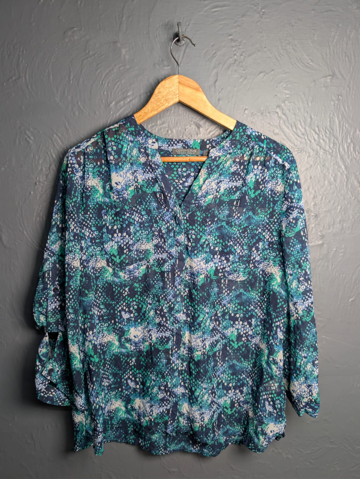 Women's multicolored, v-neck pattern and button up sheer blouse