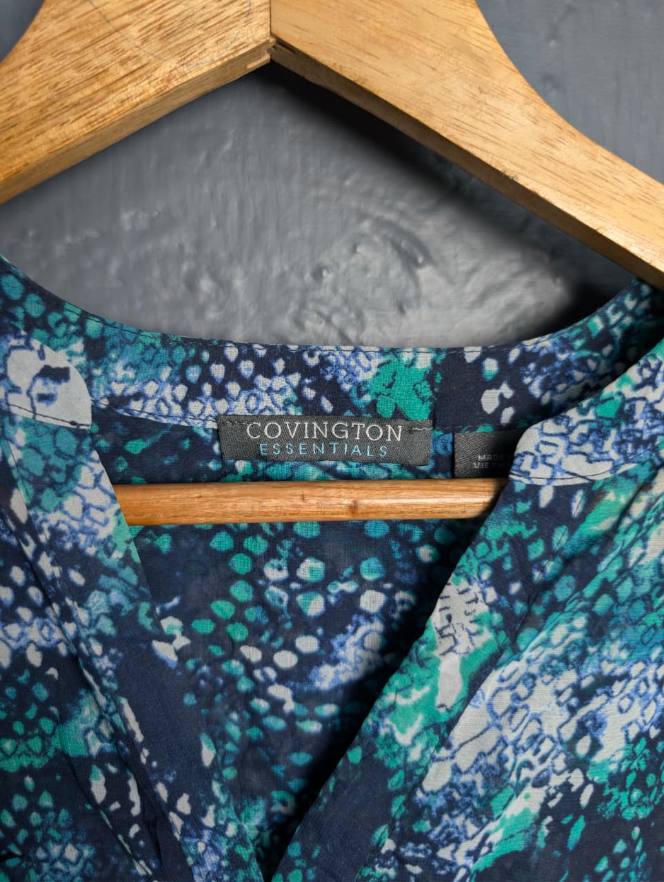 Women's multicolored, v-neck pattern and button up sheer blouse