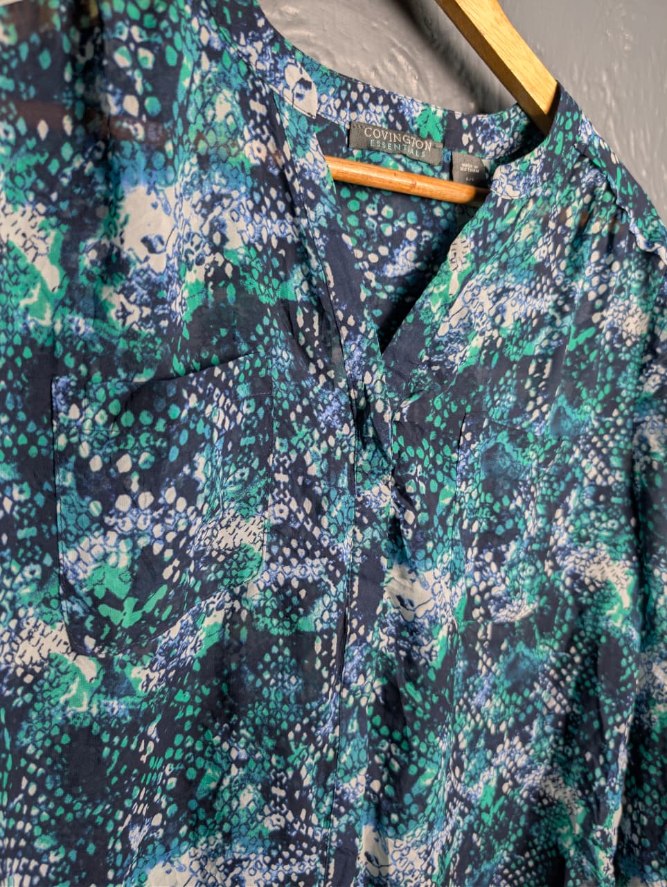 Women's multicolored, v-neck pattern and button up sheer blouse