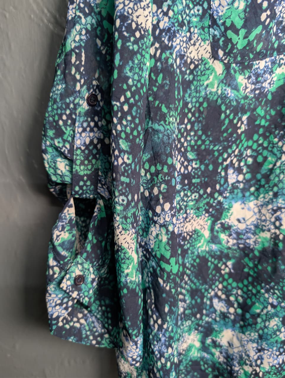 Women's multicolored, v-neck pattern and button up sheer blouse