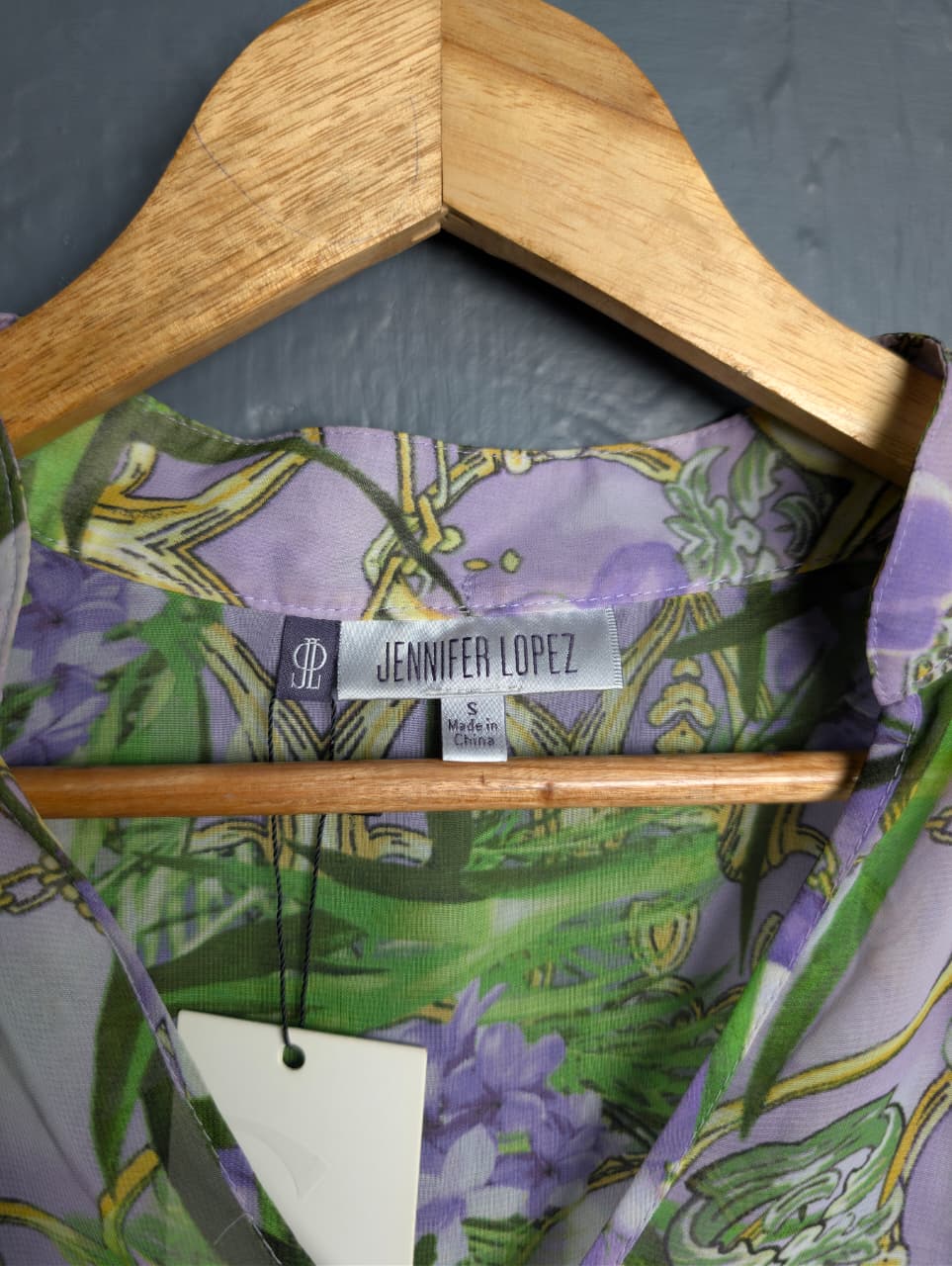 Jennifer Lopez sheer floral palm print blouse.