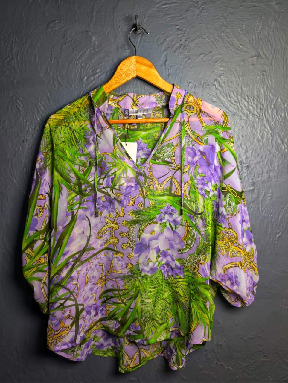 Jennifer Lopez sheer floral palm print blouse.
