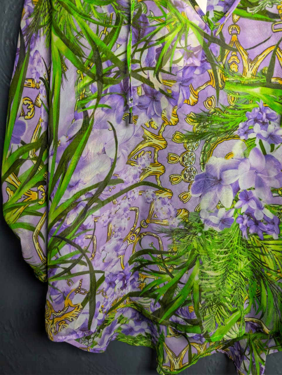 Jennifer Lopez sheer floral palm print blouse.