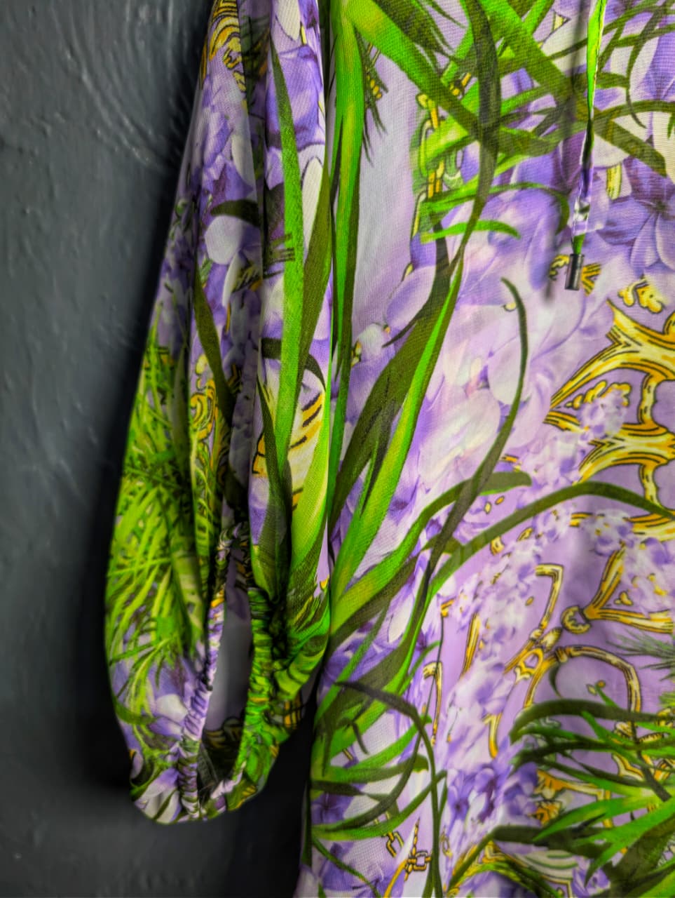 Jennifer Lopez sheer floral palm print blouse.