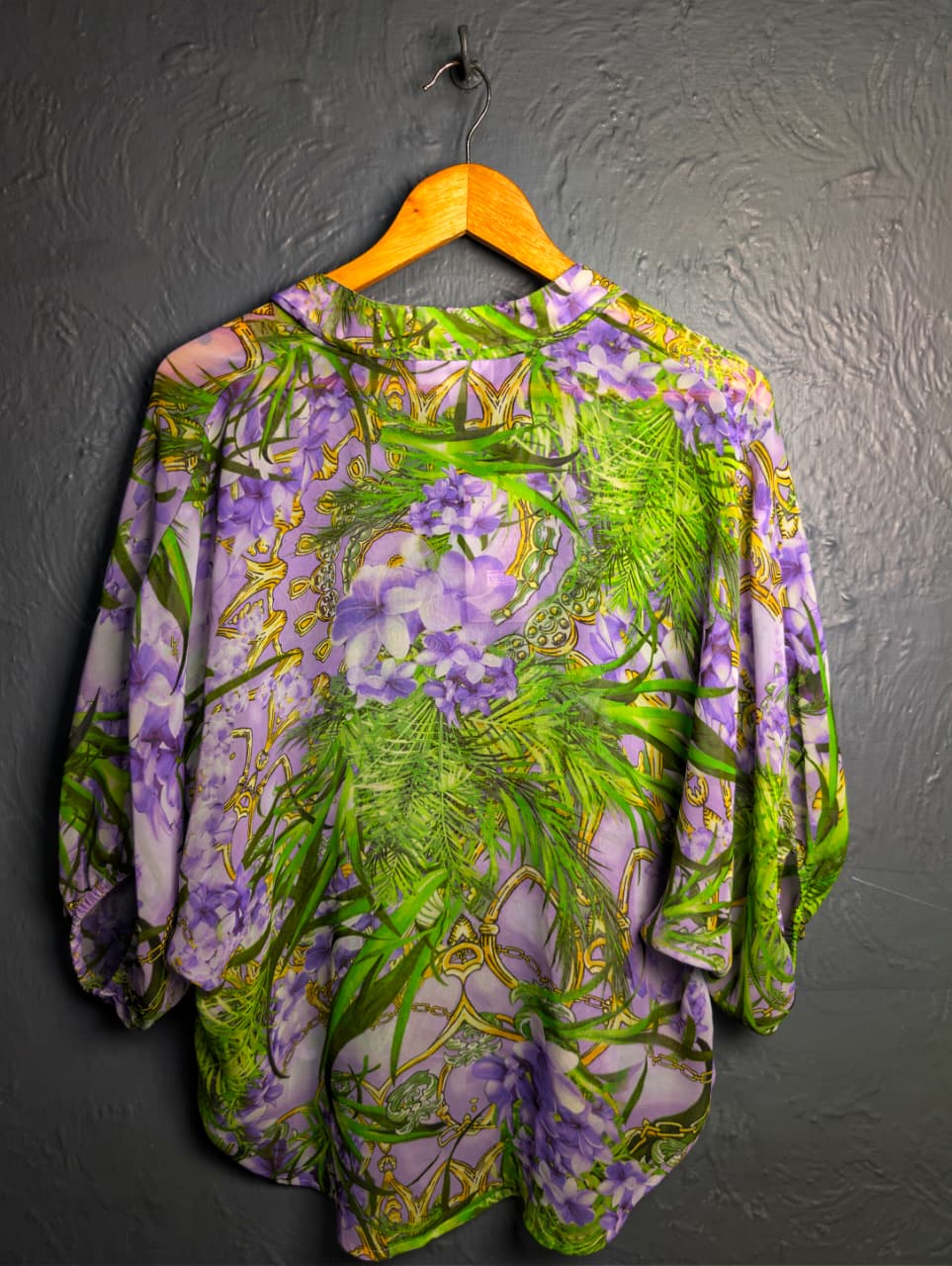 Jennifer Lopez sheer floral palm print blouse.