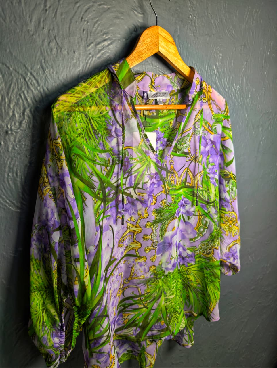 Jennifer Lopez sheer floral palm print blouse.