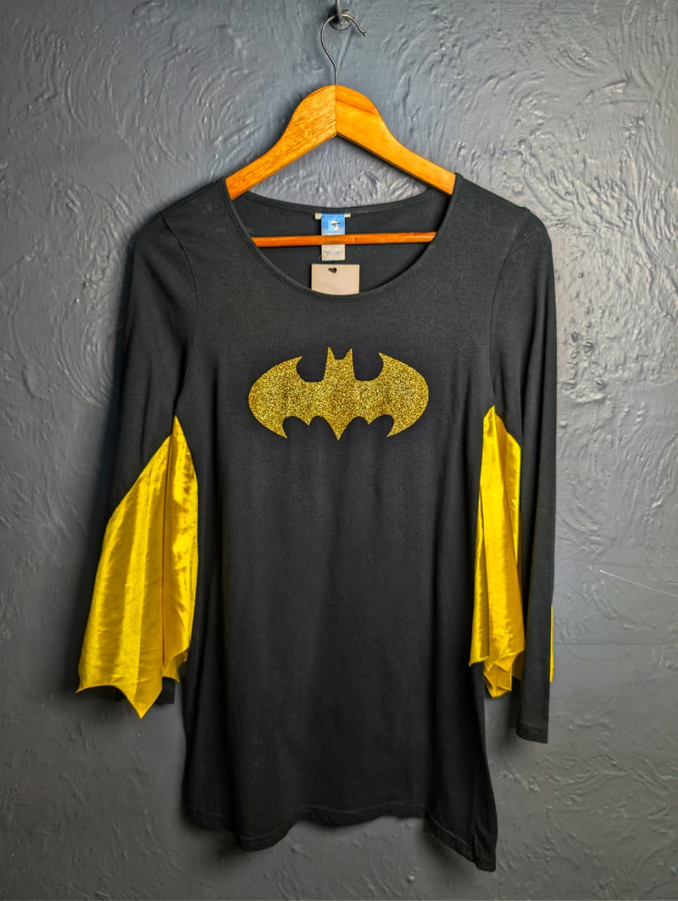 DC Comics Batgirl costume top with a glittery gold Batman logo