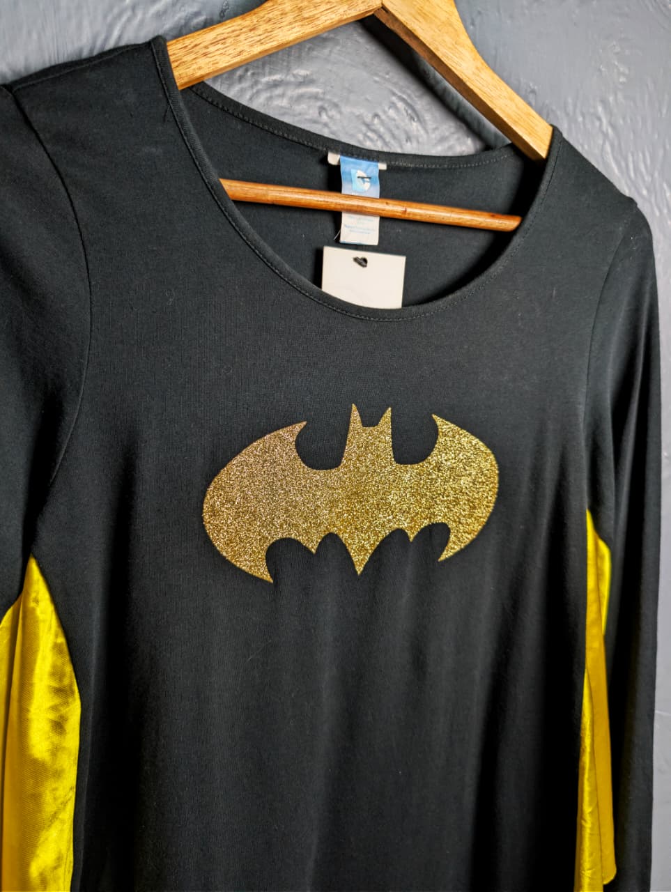 DC Comics Batgirl costume top with a glittery gold Batman logo