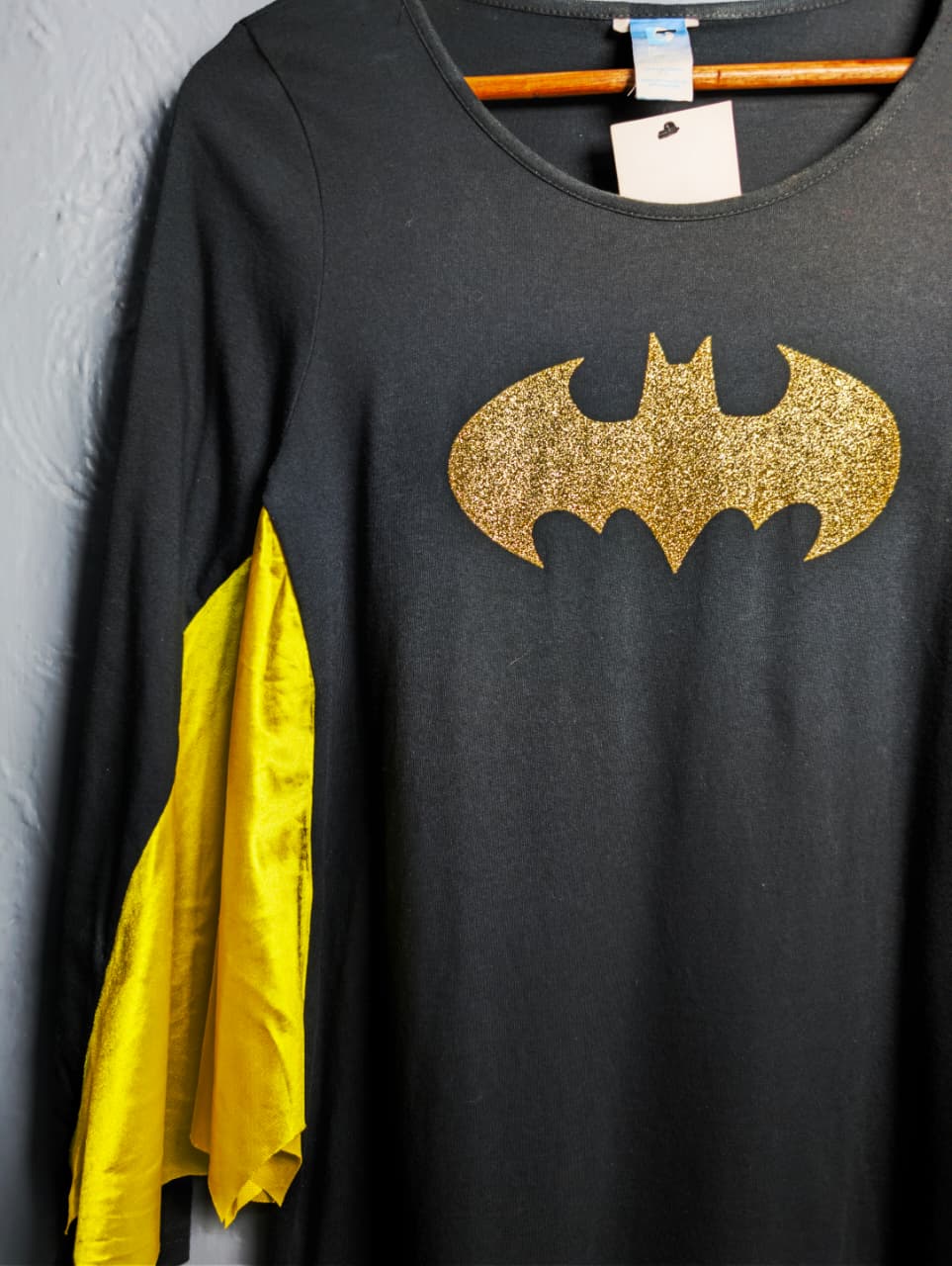 DC Comics Batgirl costume top with a glittery gold Batman logo