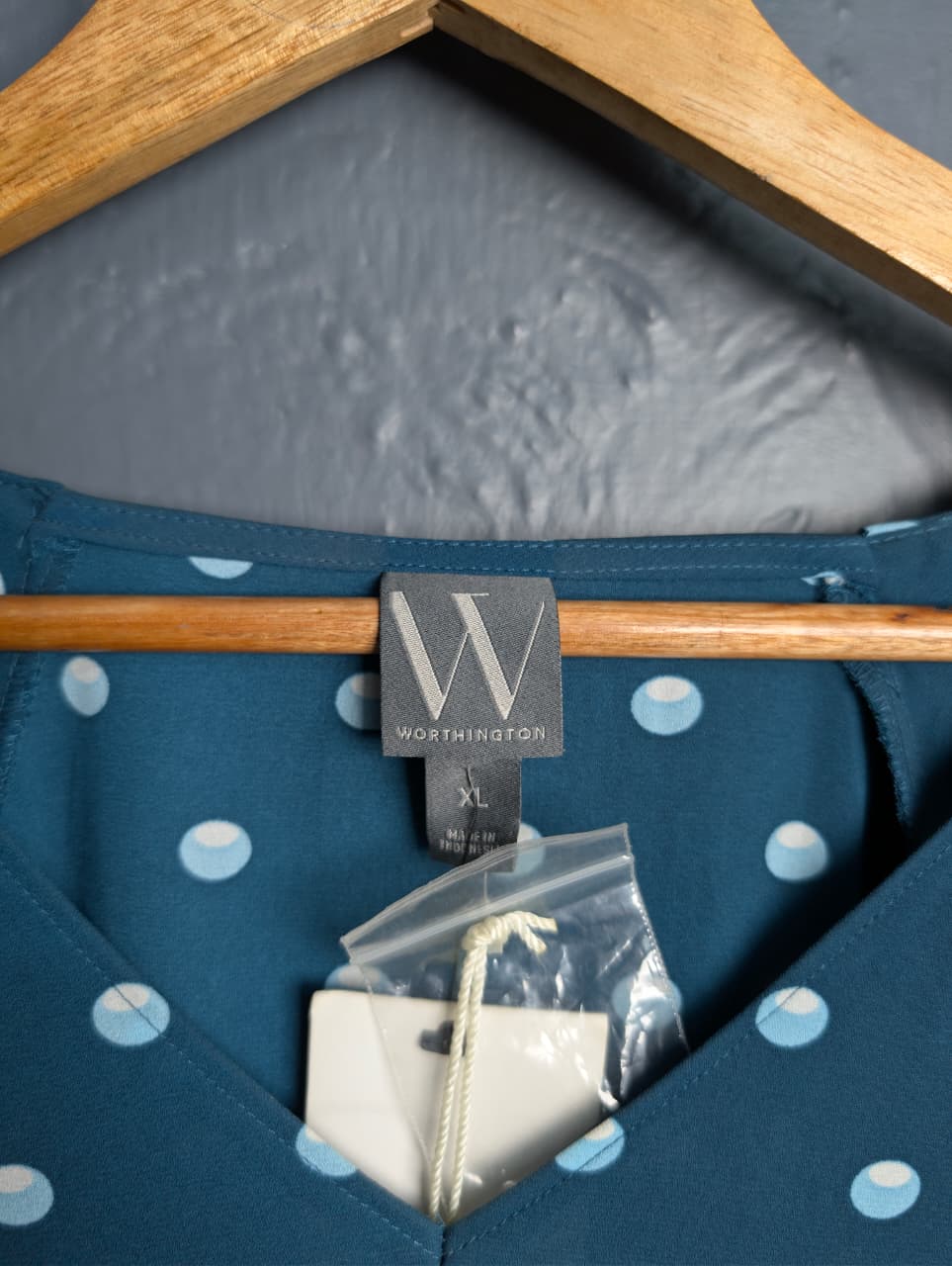 Brand New Worthington teal & polka dot top featuring short puff sleeves and a v-neckline.
