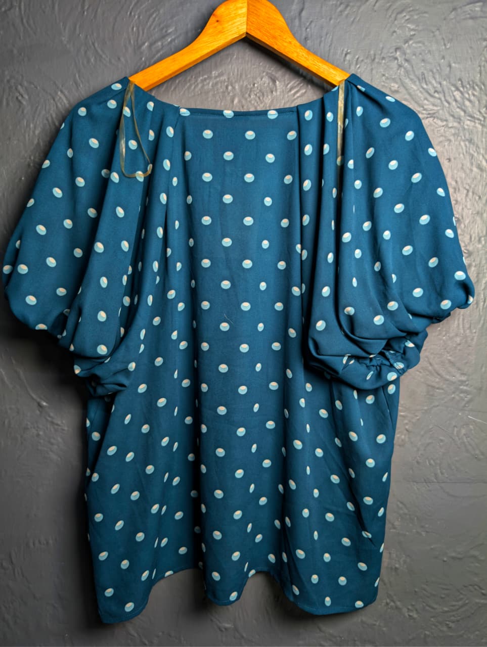 Brand New Worthington teal & polka dot top featuring short puff sleeves and a v-neckline.