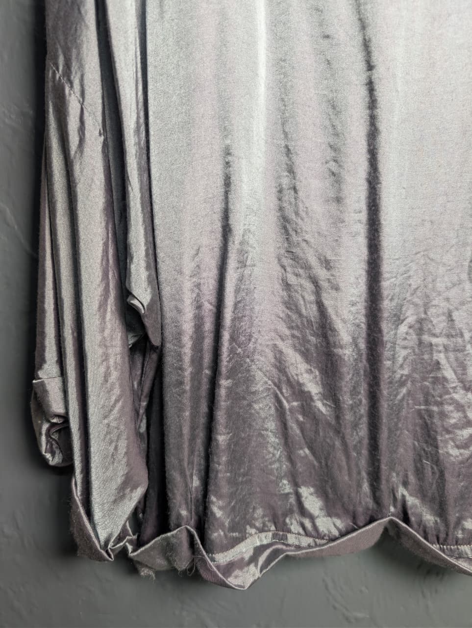 Silver satin-like top with rhinestone embellishments