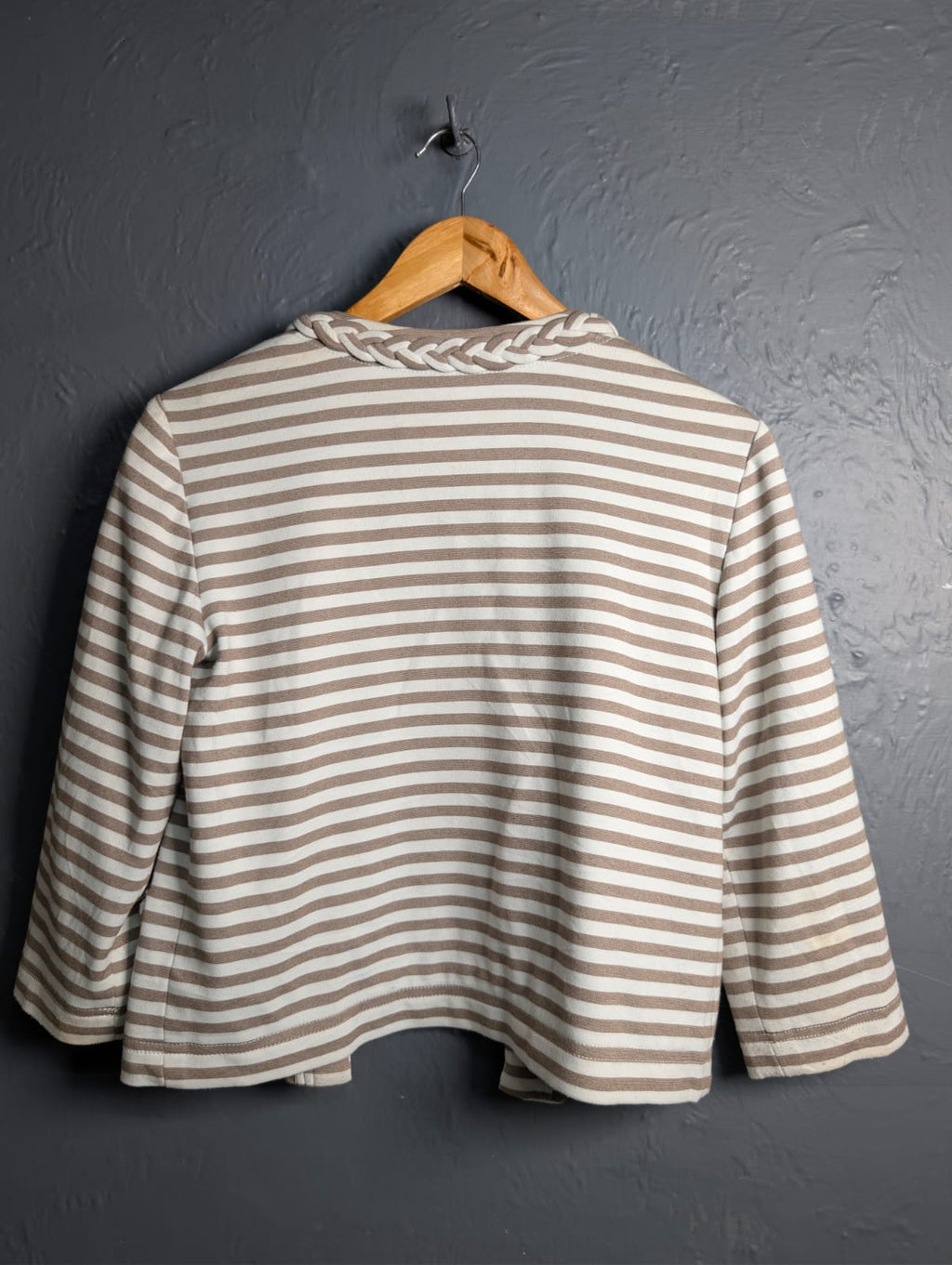 Women's open-front jacket with braided trim along the collar